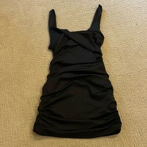 Black tight-fitting club dress. Size L but runs smaller.